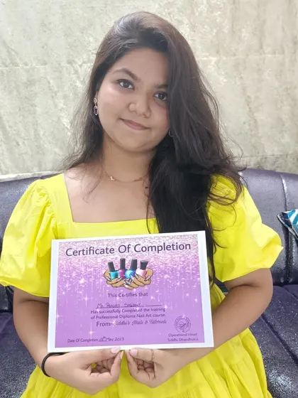 A proud moment for a student who has just completed the Professional Diploma Nail Art course. This certification marks her entry into the professional nail industry.