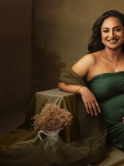 A closer crop that focuses on her joyful expression and the beautiful details of the setting.