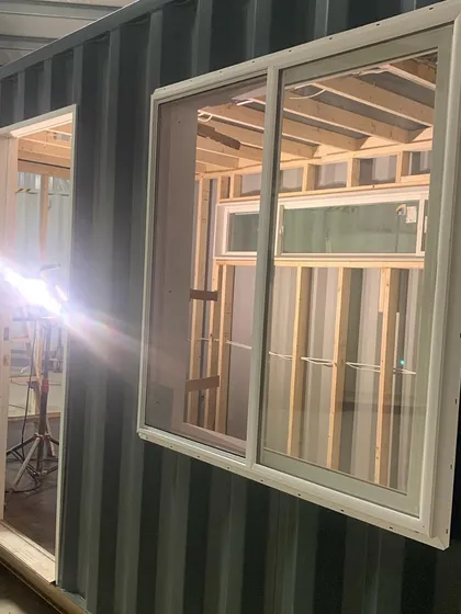 Here you can see our precise fabrication process in action. A specialist is welding the door frame of a 20-foot container, which is being converted into a custom music studio. Every build happens in our controlled workshop to ensure the highest quality.