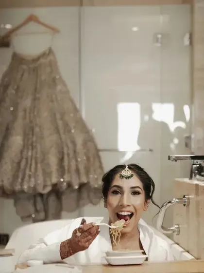 A bride's gotta eat! This fun and candid shot of the bride enjoying some noodles in the bathtub before getting fully dressed is a reminder that we capture the real, unstaged moments too.