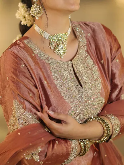 A detail shot of my Sundarkand Path outfit. The intricate silver embroidery and pearl choker add a touch of elegance to the modern sharara suit, showing how accessories can complete a look.