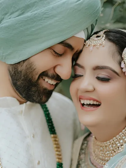 Capturing the serene beauty of an Anand Karaj bride. This look is all about soft, ethereal makeup that enhances her natural grace. The closed-eye shot highlights the delicate eyeshadow work and the overall peaceful glow perfect for a daytime ceremony.