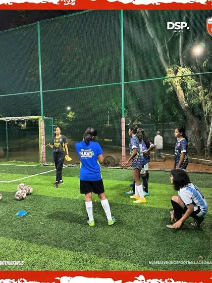 The calm before the storm. Here, our girls are seen on the turf getting ready for a drill session, tying laces and getting focused. Every practice is a step towards greatness.