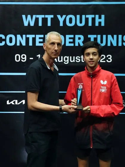 Rohan Dani receiving his U-15 bronze medal trophy from an official at the WTT Youth Contender tournament in Tunisia, an important milestone in his international table tennis career.