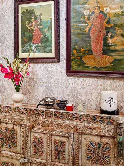 An old-world carved console stands in Aditi Rao Hydari's home, topped with beautiful paintings of Indian goddesses. This little vignette is a perfect blend of her spiritual side and her love for traditional Indian art and craftsmanship.