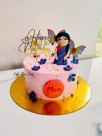 Every mom deserves a beautiful cake. A custom design with a fondant figure in a saree.