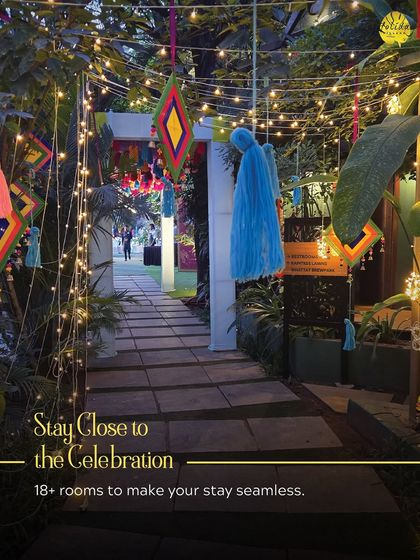 A festive entrance decorated with colorful tassels and fairy lights. This setup ensures the celebration begins the moment your guests arrive, with over 18 rooms available to keep them close.