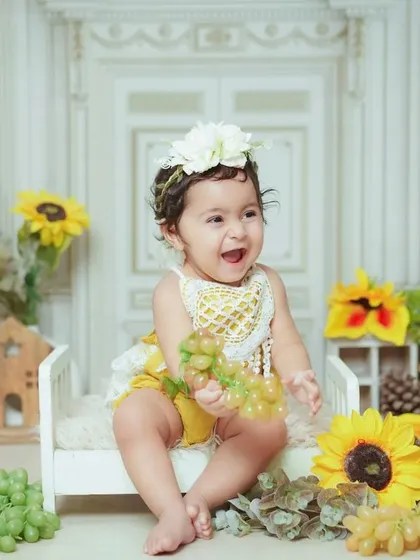 A burst of laughter in our sunflower-themed setup. We love capturing these genuinely happy moments.