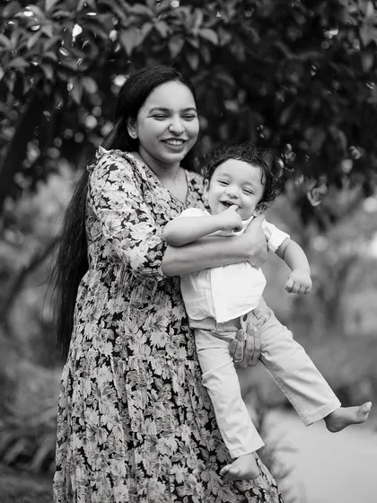 A mother's love and a child's hearty laugh, captured in a timeless black and white portrait. These are the honest, joyful moments that I live to photograph, creating memories that will be carried forever.
