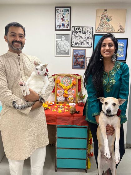 A family portrait with my husband Ali, our dog Pantu, and our cat Chaddi during Diwali. My pets are an integral part of my family and my life.