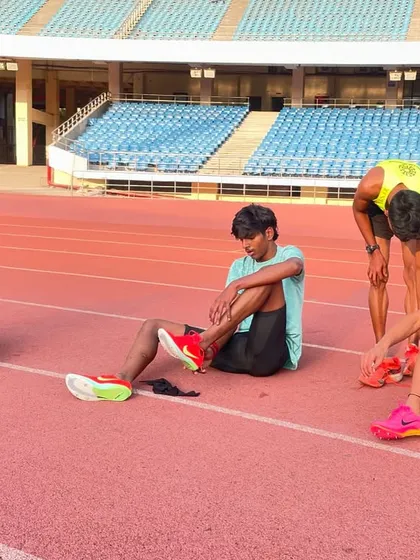 Post-workout recovery on the track. After an intense session in the sand pit, my athletes take time to stretch and recover, getting ready for the next day's grind.