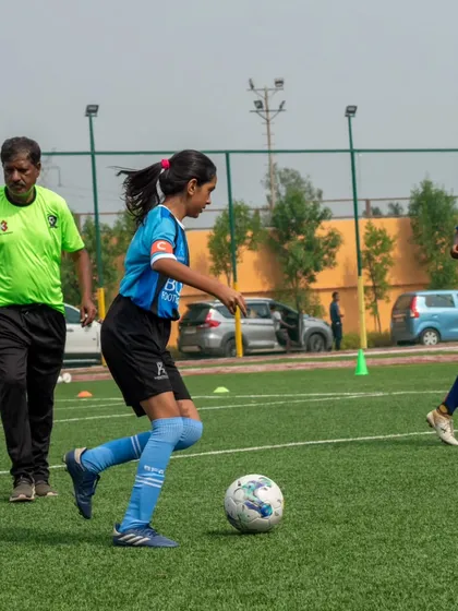 Development is in our DNA. Here, one of our players hones her dribbling skills under the watchful eye of an AIFF certified coach, showcasing the professional, hands-on training every player receives.