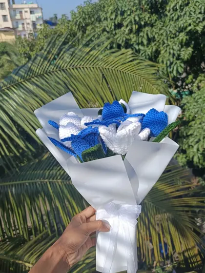 A side view of the custom bouquet, tied with a lovely white ribbon.