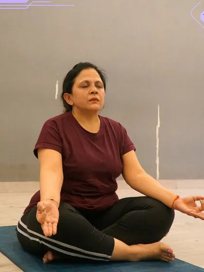 A member finds her center during a meditation practice in our yoga class.