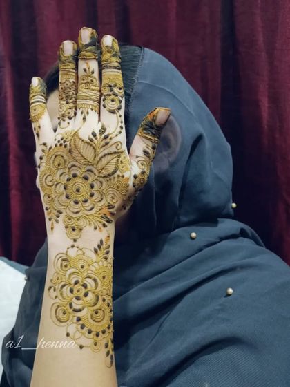 A client showing off her beautiful floral henna for Eid.