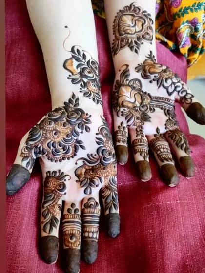 This design combines florals with peacock-inspired shapes, creating a unique and artistic look.