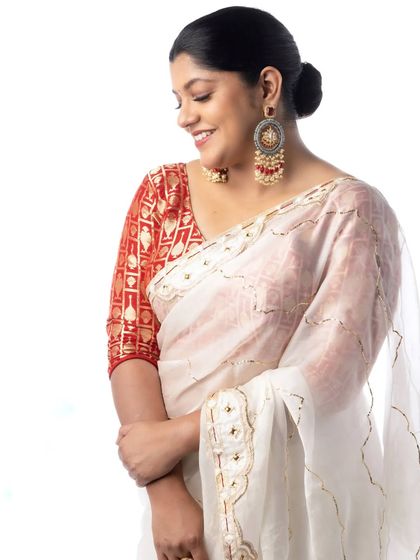 A candid moment with Aparna Balamurali. Her smile truly completed the look we created together.