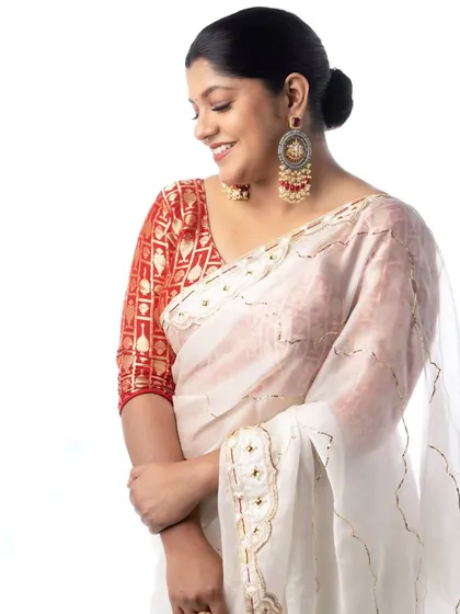 A candid moment with Aparna Balamurali. Her smile truly completed the look we created together.