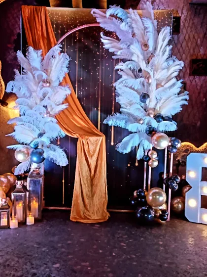 Another view of the glamorous 80th birthday decor, showing the full arrangement with lanterns and balloons at the base.
