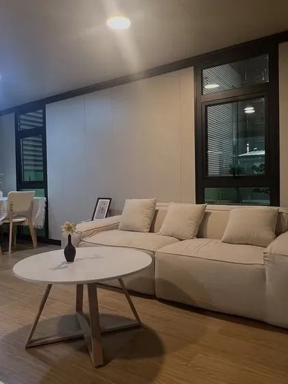 This is the interior of one of our popular modular homes, showcasing a clean, contemporary living and dining area. I focus on creating bright, comfortable spaces that are ready for you to move in and make your own.