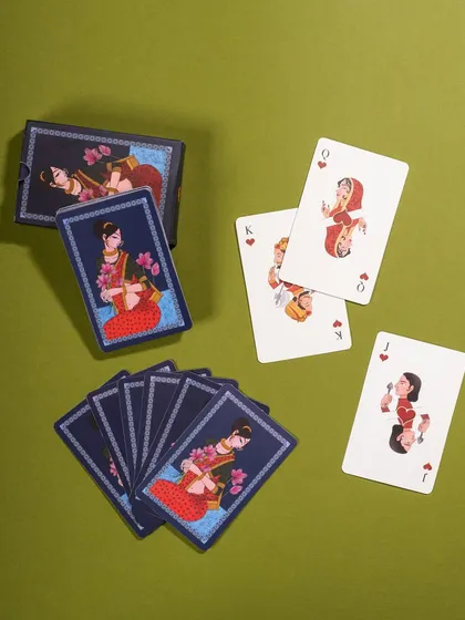 A styled shot of Namostutay playing cards, arranged neatly on a solid green background. This clean composition is perfect for catalog and website use.