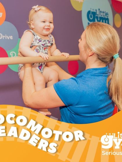 A mother's gentle support gives her baby the confidence to explore new heights. This simple hanging exercise is fantastic for developing a baby's grip strength and introducing them to the fun of gymnastics.