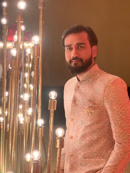 A photo from an 80th birthday celebration where I performed a live sand art show, telling the life story of the guest of honor.