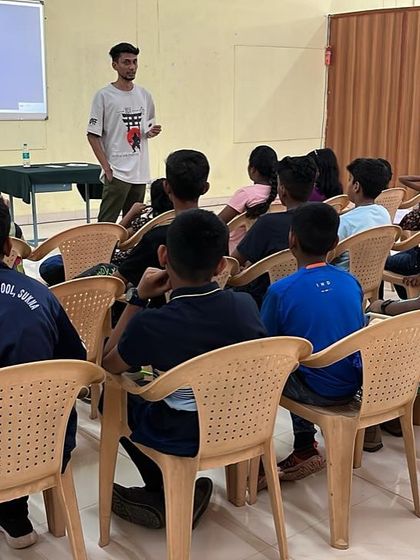 A classroom-style briefing session where young students learn the theory and safety principles of sport shooting before their practical session begins.