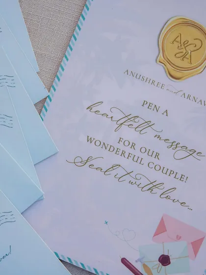 'Pen a heartfelt message for our wonderful couple!' We create beautiful, interactive stations like this one, allowing guests to share their love and create a cherished keepsake for the couple.