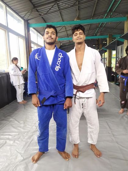 Posing with my coaches and senior belts. Learning from experienced practitioners is the key to growth in Brazilian Jiu-Jitsu.