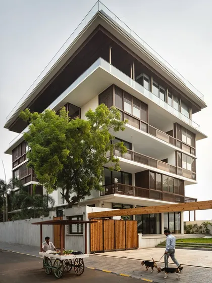 We believe a home should be in dialogue with its surroundings. This multi-generational residence in Nagpur, 'The Light House', uses operable timber screens and staggered balconies to create privacy and shade, while remaining connected to the life of the neighborhood.