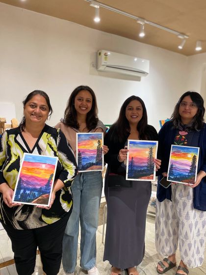 This group of friends created matching sunset paintings, each with its own unique flair.