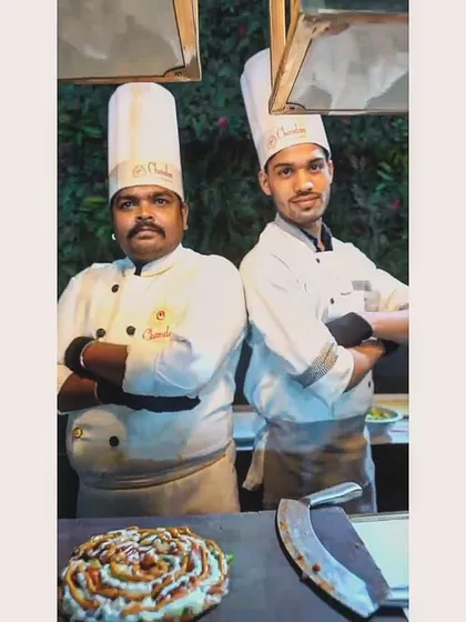 Two of my talented chefs, proud to stand by their delicious creation. They are the artists behind the flavourful memories we serve.