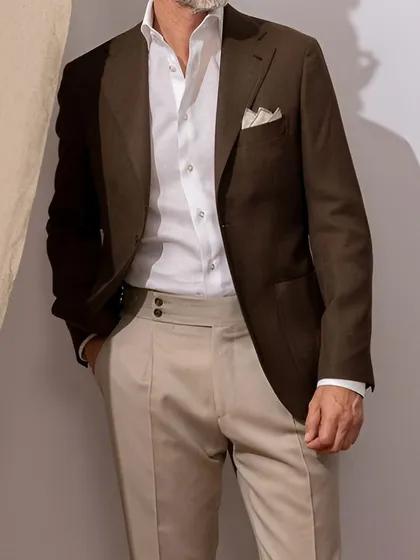 A must-try combination for any elegant occasion: a dark brown blazer, a crisp white shirt, and ivory trousers.