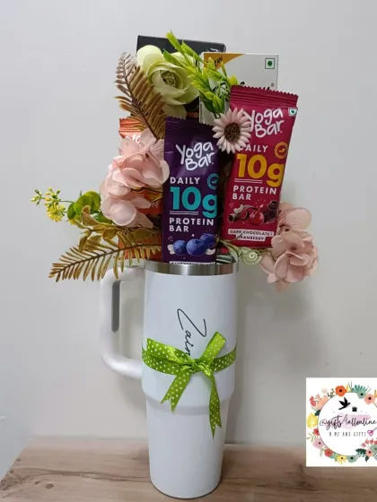 A full view of the Stanley mug bouquet, a modern and practical gift idea for anyone who loves snacks and a good reusable mug.