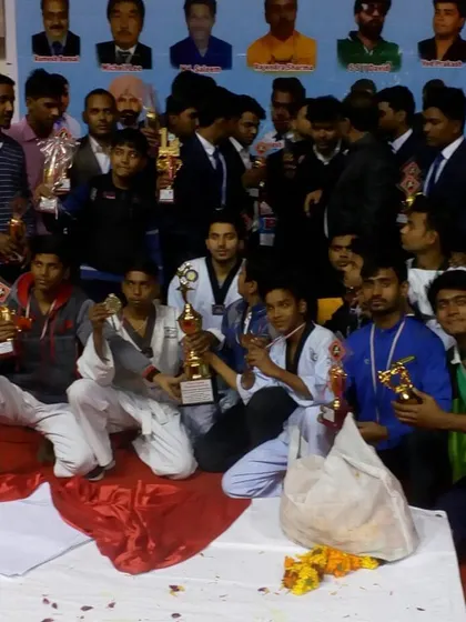 More celebration from our team, showcasing the numerous trophies and medals won at the event.