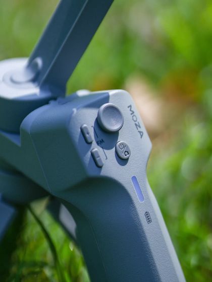 A close-up on the controls of the MOZA gimbal. This detail shot emphasizes the professional features of the equipment I use to control and perfect my video content.