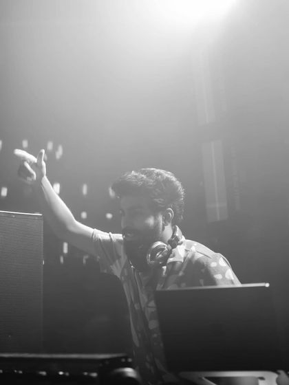 A black and white shot of me pointing to the crowd, creating a connection from the DJ booth.