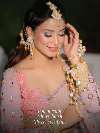 A fun and fresh look with a pop of color on the eyes, glowy blush, and glossy coral lips. This is perfect for a bride who wants to play with color for her pre-wedding events.
