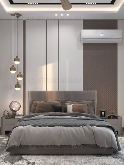 The main bed wall in the Shiv Vihar room, featuring a combination of white and brown panels and modern, suspended pendant lights.