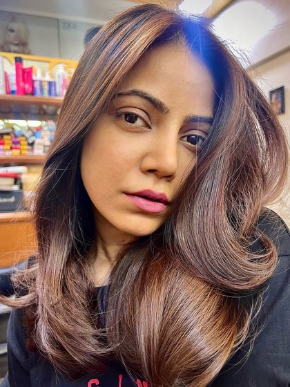 A selfie from the client, loving her new caramel balayage. The color melt is seamless, and the style is perfect for both everyday wear and special occasions.