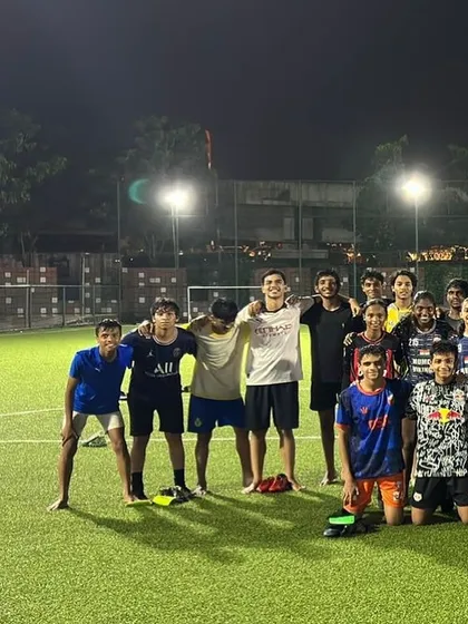 Unity. A candid shot of the team relaxing together on the turf after a hard session.