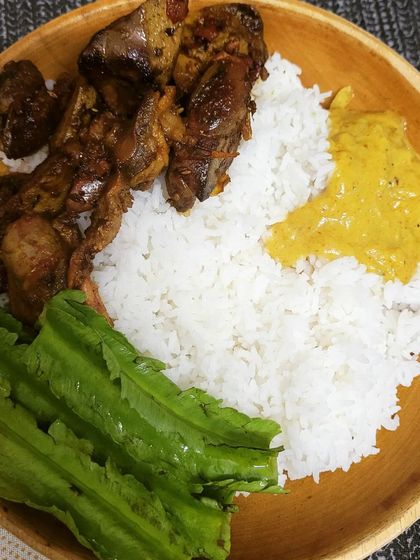 A simple and nutritious meal of rice, chicken gizzard fry, fresh winged beans, and a side of dal. This is healthy home cooking at its best.