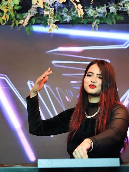 Dancing along with the crowd while managing the mix. I believe a DJ should be part of the party, not just behind it.