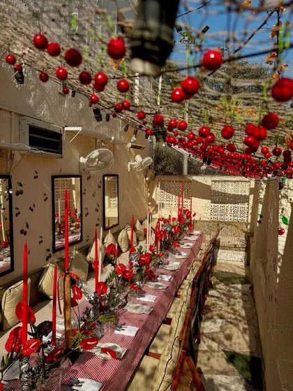 The ambiance of our annual Christmas brunch, set in a cherry-themed wonderland. We believe in creating a complete sensory experience, where the decor and atmosphere are just as important as the exquisite food we serve.