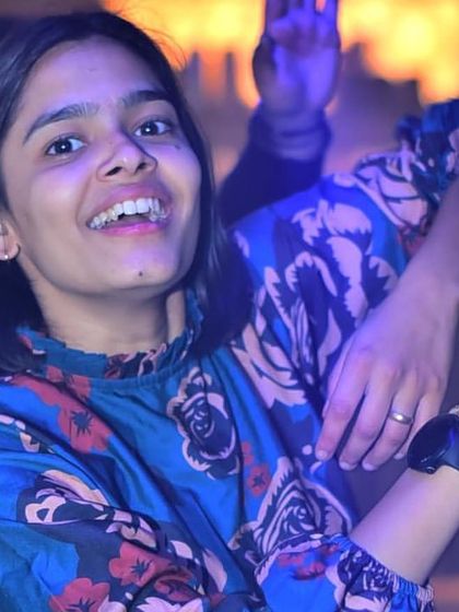 A happy face in the crowd, enjoying the music and the atmosphere.