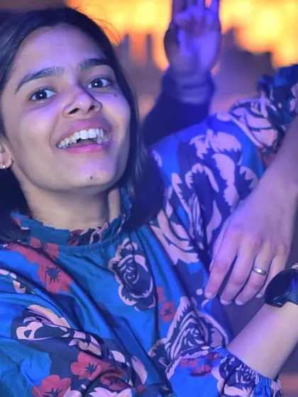 A happy face in the crowd, enjoying the music and the atmosphere.