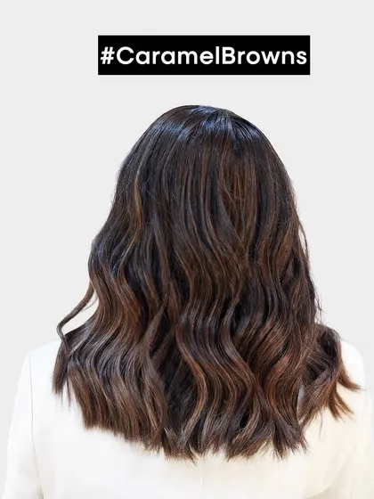 The back view of this stunning caramel brown balayage. The waves are perfectly defined to show off the seamless blend of highlights and lowlights.