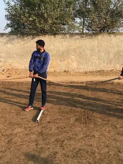Teamwork is also about building strength together. Players participate in a tug-of-war exercise, a great way to build collective power and unity.