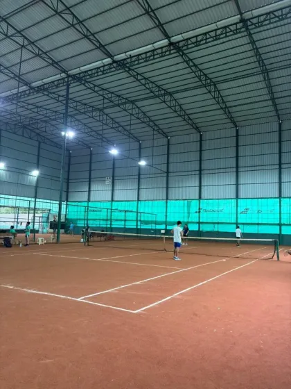 A wide view of the competitive action at the inter-academy tournament, with multiple matches happening simultaneously.